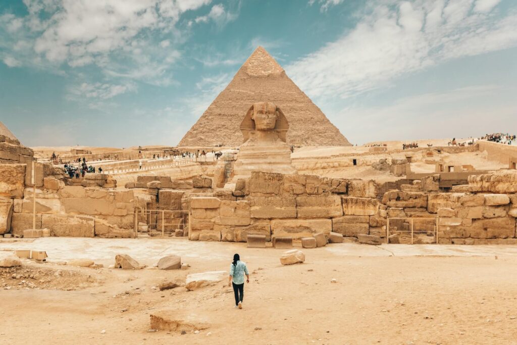 Man infront of the pyramids of Giza