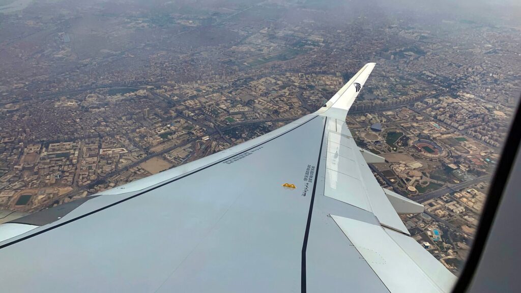 EgyptAir plane wing over the city